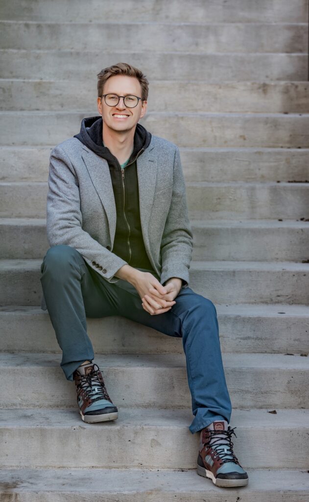 Carter Sowers, Asheville NC Realtor sitting on stairs